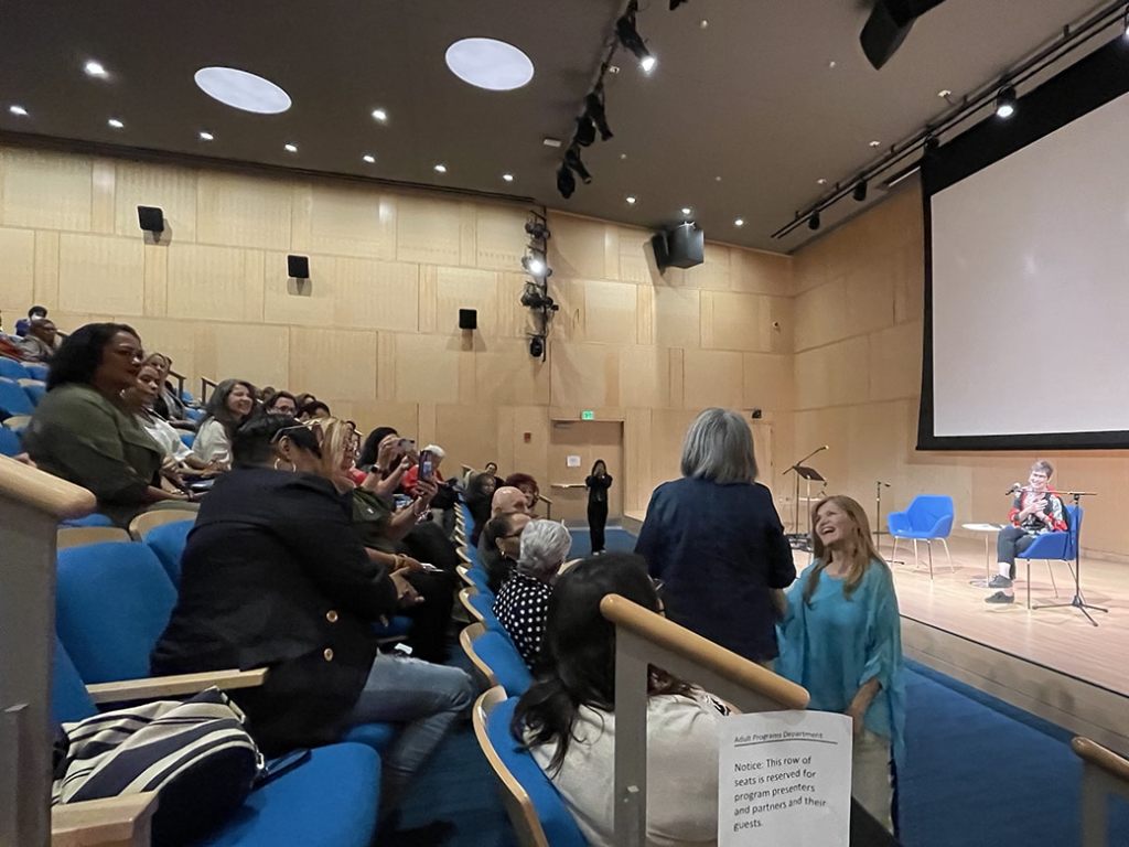 latino pioneers film screening - photos of attendees in crowd at Boston Public Library, Blanca Bonilla organizor.